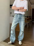 Distressed straight denim pants